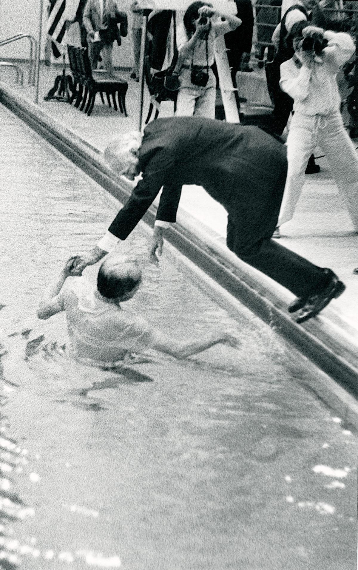 B.D. Owens was pulled into the pool during the dedication of the Robert P. Foster Aquatic Center in 1981. 